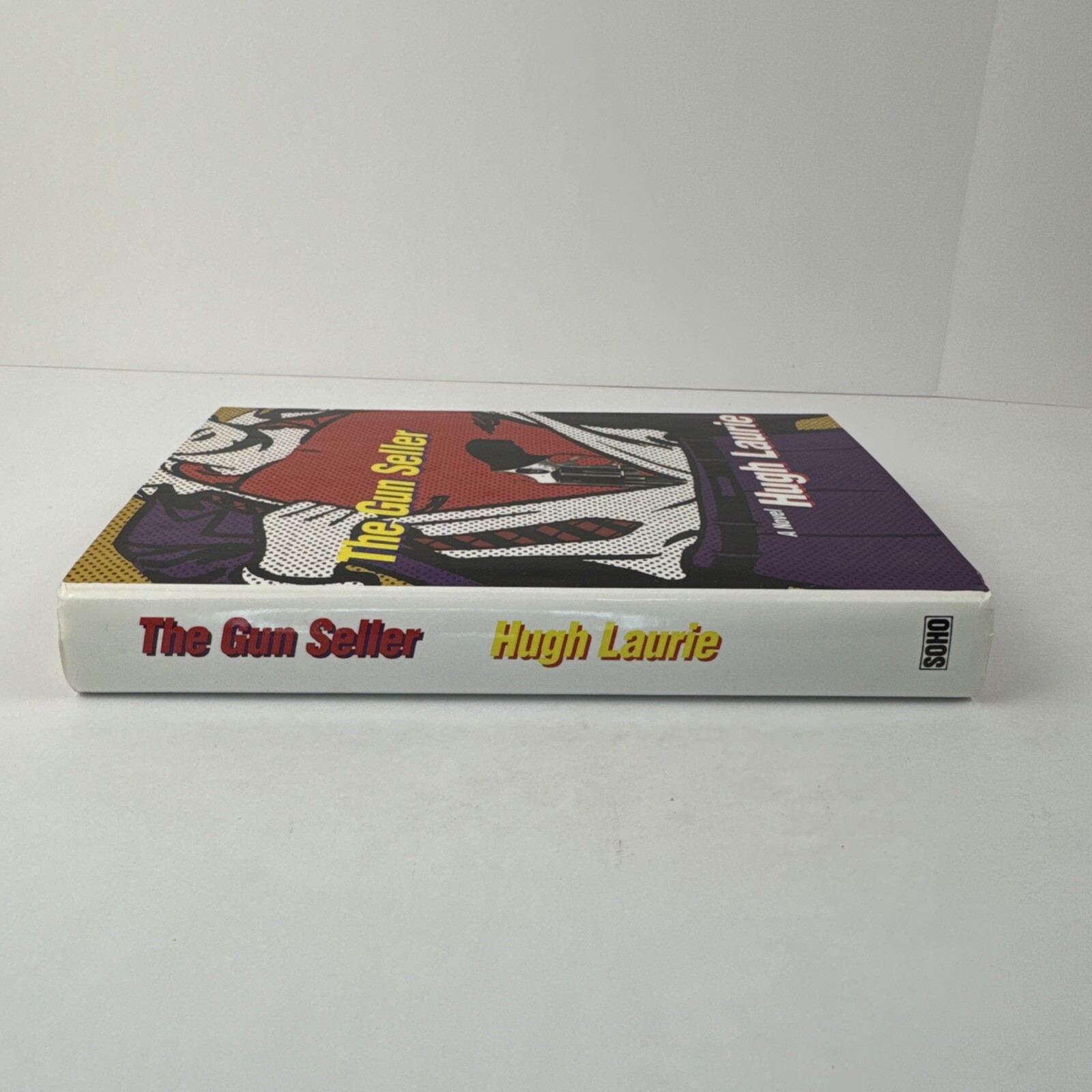 The Gun Seller by Hugh Laurie (1997, HCDJ) SOHO 1st US Edition, 1st Printing