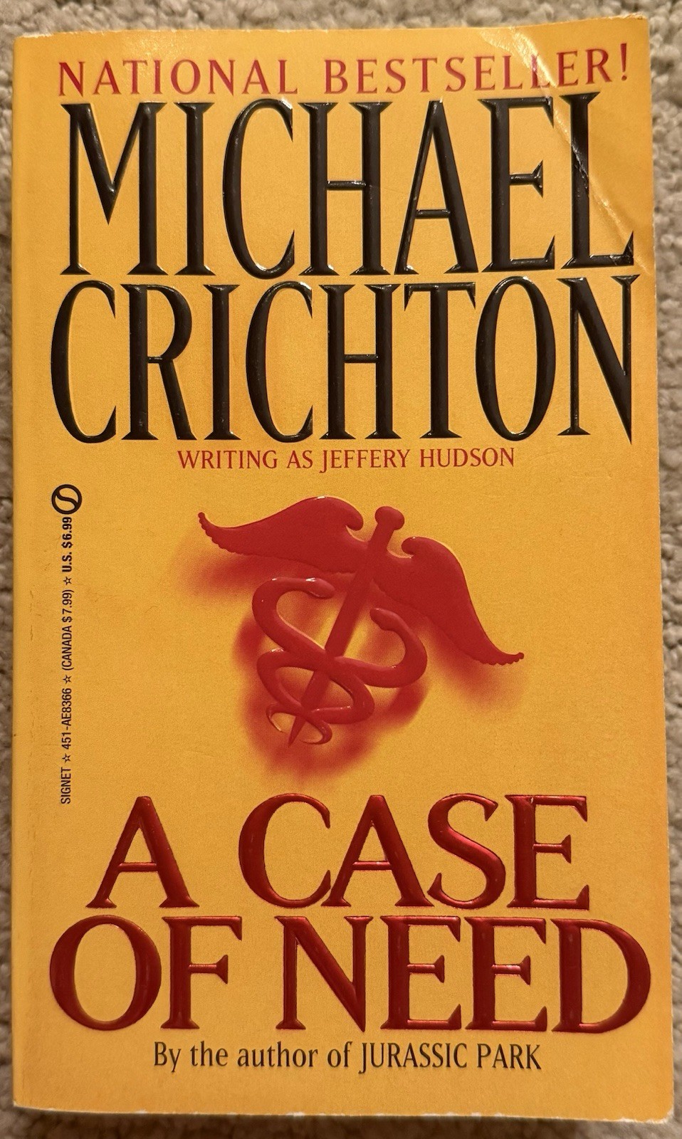 A CASE OF NEED BY JEFFREY HUDSON AKA MICHAEL CRICHTON 1994 SIGNET PAPERBACK